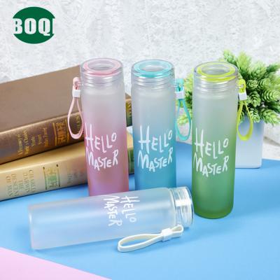 China Wholesale Colorful Frosted Hello Head Sustainable High Quality Glass Water Cup Cheap Glass Drinking Bottle With Lid for sale