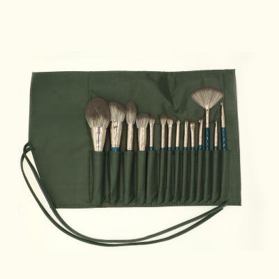 China Daily Makeup Tools 2021 Hot Sale Ultra Soft Professional Makeup Brush Set 14pcs Blue Wooden Handle With Green Belt Strap Rolling Case for sale