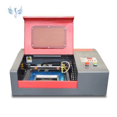 China Water-cooled 40w 60w 80w 3020 Model Laser Cutting Engraving Machine Good At Stamp Print for sale