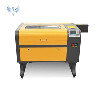 China Water-cooled Factory hotsale 4060 100W wood laser engraving machine co2 acrylic laser cutting machine High-Quality with ruida system for sale