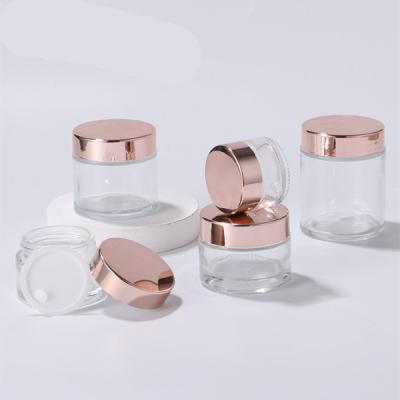 China Custom Lead Free Cosmetic Packaging Supplier Kit Box Set Luxury Glass Cream Jars With Rose Gold Lid for sale