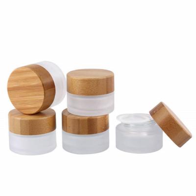 China Lead Free Skin Care Packaging Set Eco Friendly Bamboo Caps Glass 20g 30g 50g 100g Frosted Cream Jar for sale