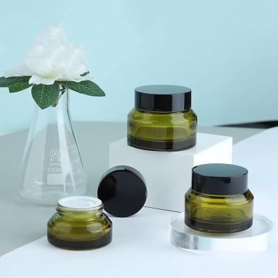 China Lead Free Glass Shoulder Pickle Green Shade Cream Bottle Face Cream Cosmetic Packaging for sale