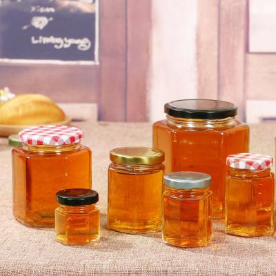 China Hexagon 6oz Lead Free Empty Glass Jars Honey Glass Cookie Storage With Screw Lid for sale