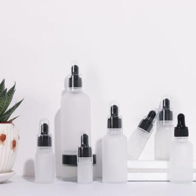 China 2021 hot sale lead free white frosted glass essential oil bottles15ml 30ml 50ml 100ml essential oil bottle for sale