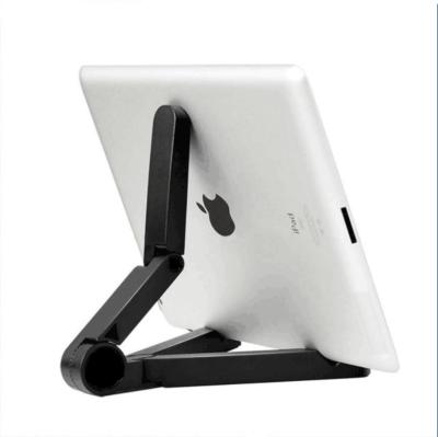 China Folding Tablet Plastic Holder Stand Cell Phone Person Holder Triangle Cell Phone Lazy Desk For Tablet for sale