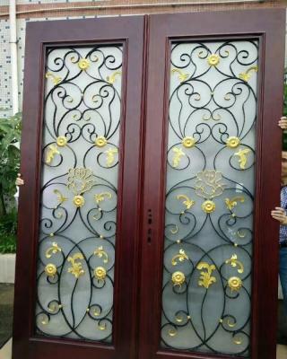 China Latest swing design wrought iron wood front door for sale