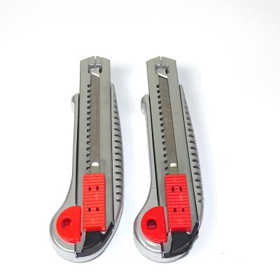 China Slide Open Plastic Box Cutter Spare Part Safety Four Blades Handle Utility Knife for sale