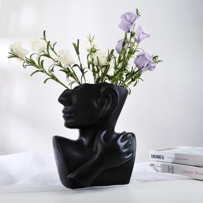 China Modern Minimalist Black Centerpiece Design Human Face Ceramic Flower Vase Bud Vase Tall Posy Bouquet for sale