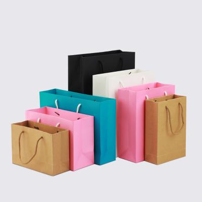 China Simple Handmade Cowhide Black White Black Blue Pink Holiday Party Favor Paper Gift Packaging Bag Backs Customized Printing Logo for sale