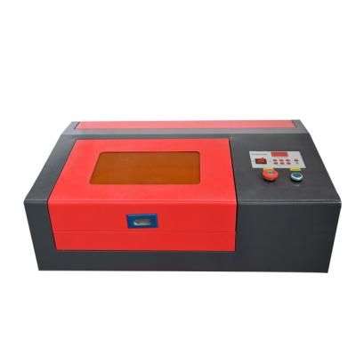 China Laser Engraving Rubber Stamp Laser Engraver CO2 3020 Mini Laser Engraving Machine 40W for sale