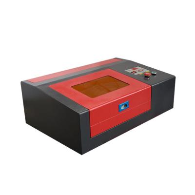 China Laser Engraving Mini 40W CO2 Laser Engraving Machine Laser Cutting Machine 3020 for Rubber Stamp Acrylic Wood Fabric for sale