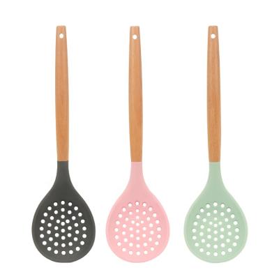 China Viable Wholesale Food Grade Silicone Kitchen Spoon Strainer Tools Wooden Handle Heat Resistant Cooking Slotted Spoon for sale