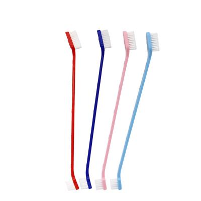 China Factory Wholesale Viable Double Head Dog Toothbrush Feeds Stabilized Nylon Wire Dog Paw Printing Plastic Cat Dog Toothbrush for sale