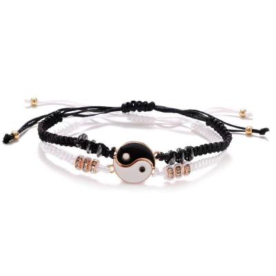 China 2021 Ethnic weave bracelet yin-yang friendship alloy style tai chi bracelet popular black and white couples adjustable chat for sale