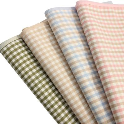 China Anti-static Hot Sale Ramie Combed Cotton Plaid 80*120cm Portable Waterproof Baby Diaper Changing Pads for sale