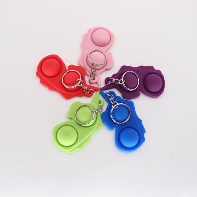 China Rubber Set Trigger For Kids Adults Worry Birthday Gift Autism Key Chain Toys Jumping Shapes for sale