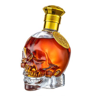 China Beverage Creative Clear Glass Bottle Skull Head Shape Wine Bottle 330ml 750ml Whisky Brandy Liquor Bottle for sale