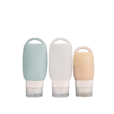 China Silicone 38/60/90ml portable refillable silicone empty bottle with carabiner hanging bottle with clip for sale