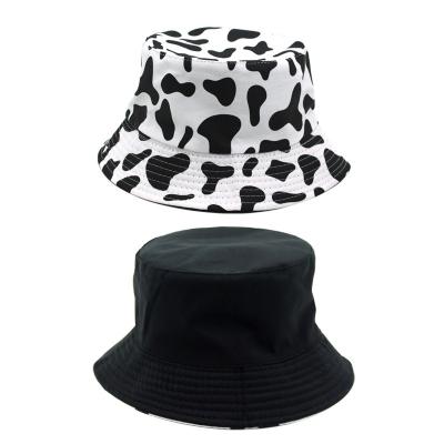 China 2301 Cow Casual Pattern Printed Outdoor Leisure Shading Double Sided Bucket Hat for sale