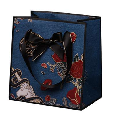 China Recyclable Custom Design Ribbon Handle Blue Luxury Jewelry Cosmetic Gift Apparel Shopping Packaging for sale