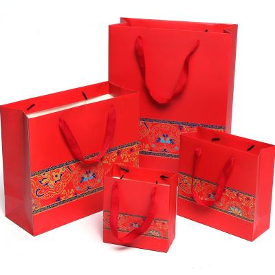 China Hot Sale Red Wedding Paper Bag Wholesale Kraft Paper Packaging Bag Recyclable for sale