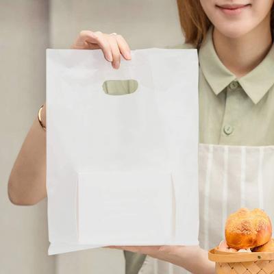 China Moisture Proof Heat Sealed LDPE Die Cut Plastic Handle Bag With Logos Shopping for sale