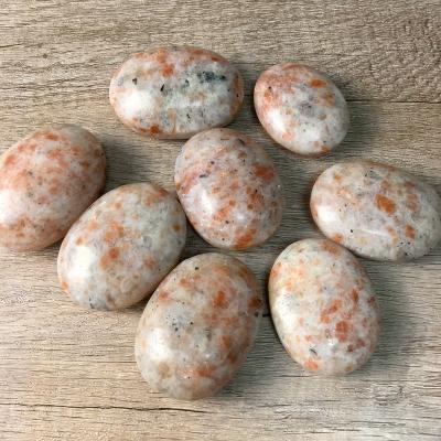 China High quality natural sunstone tumble stone healing china quartz gemstone palm crystal stone for sale