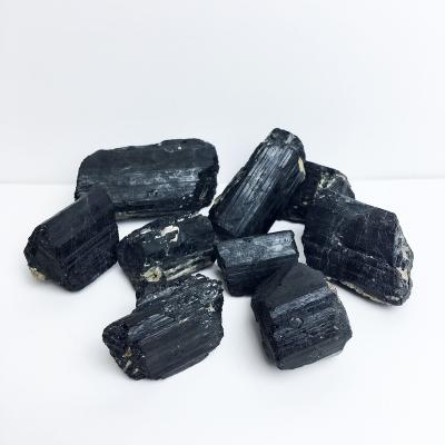 China Natural Raw Black Tourmaline China Gemstone Rock Crystal Therapy Rough Stone for sale