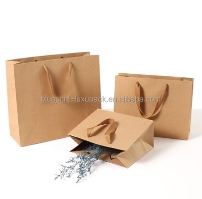 China Wholesale Custom Logo Spot Printing China Kraft Paper Clothes Shoe Box Flowers Gift Packaging Paper Bag for sale