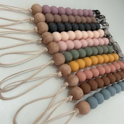 China BPA Free Custom Wooden Pacifier Holder Baby Silicone Beads Pacifier Clip for sale