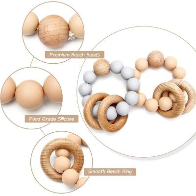 China Food Grade Material 6-12 Months Teether Baby Toys Baby Teether Wooden Silicone Wooden Toys For Newborn Babies for sale