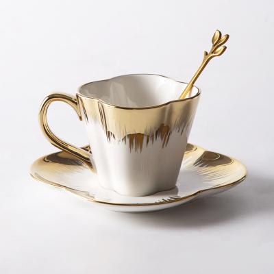 China Light Viable Nordic Luxury Gold Petal Coffee Cups And Saucer Ceramic Afternoon Tea Cup for sale