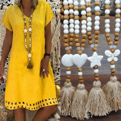 China Environmentally Friendly Bohemian Canvas Dangling Handmade Wooden Bead Chain Sweater Tassel Dress Long Necklace Women for sale