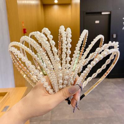 China Hair accessories beads 2022 new style lady headband 2022 lady hair circle temperament cute fairy hair pressing headdress hairpin soft outgoing circle for sale