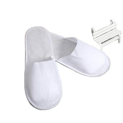 China Exquisite Disposable Hotel Amenities Nonwoven Hotel Slipper /Cheap Closed Toe Non Woven SPA Slippers for sale