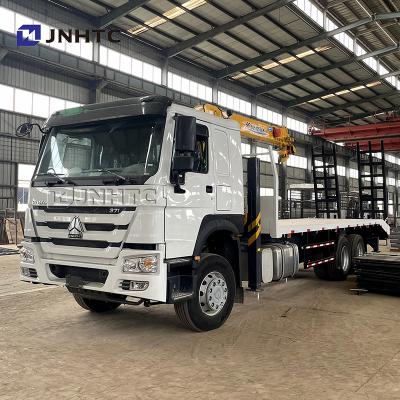 China TRUCK CRANE howo towing excavator transport truck with hydraulic telescopic booms truck mounted crane for sale for sale