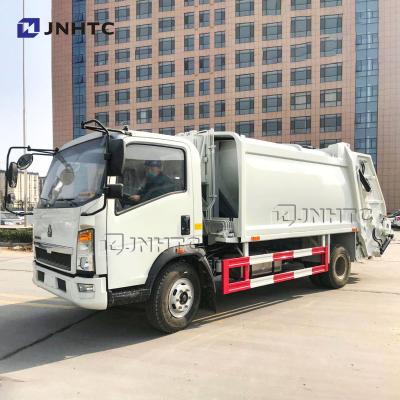 China Hotels HOWO 4x2 8cbm compact compactor garbage truck for food watse bin cleaning washing for sale