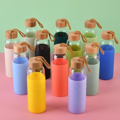 China Sustainable Caliber Customized Bamboo Cover With Glass Rope 500ML High Borosilicate Glass Cup Single Layer Silicone With Silicone Sleeve for sale