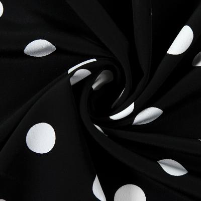 China Simple Soft Black And White Polka Dot Printed Chiffon Fabric Dress Skirt Fabric By The Meter for sale