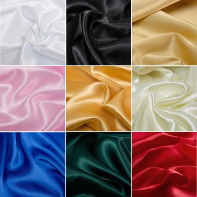 China Breathable Polyester Solid Cloth Silky Satin Fabric For Dress Curtain Background for sale