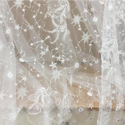 China Breathable Star Celestial Embroidered Fabric Sequin Lace Tulle Fabric For Dress Shirt for sale