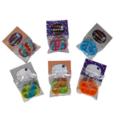 China Silica Gel Halloween Gift Stirring Person Popper Toy Pumpkin Keychain for sale