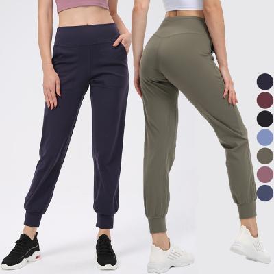 China Custom Women QUICK DRY Logo Gym Workout Outdoor Running QUICK DRY pants sports joggers with pocket for sale