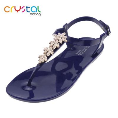 China PVC Ladies Flat T-shape Sandals With Plastic Flower for sale