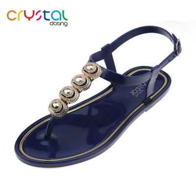 China PVC Ladies T-shape Flat Plastic Sandals With Gold Shell for sale