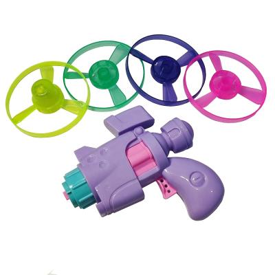 China 2022 New Fashional Outdoor Flying Plastic Bamboo Dragonfly Toy Flying Saucer Gun Disc Shooter Set For Kids for sale