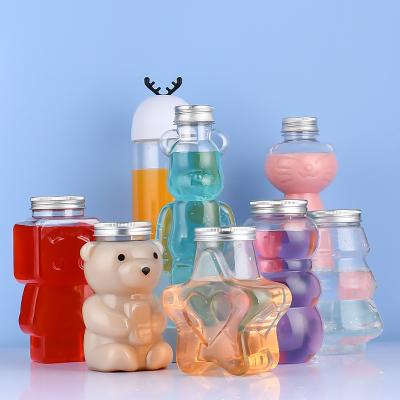 China Custom Empty Plastic Beverage Logo 16oz PET Bear Shape Juice Beverage Tea Drinking Bottle With Aluminum Cap for sale