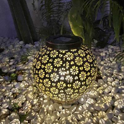 China Solar Powered Led Pattern Solar Projection Flower Charging Metal Lantern Decoration Hanging Solar Garden Lights for sale