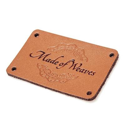 China Custom Embossed OEM Leather Patch Clothing Pu Jeans Patch Label for sale